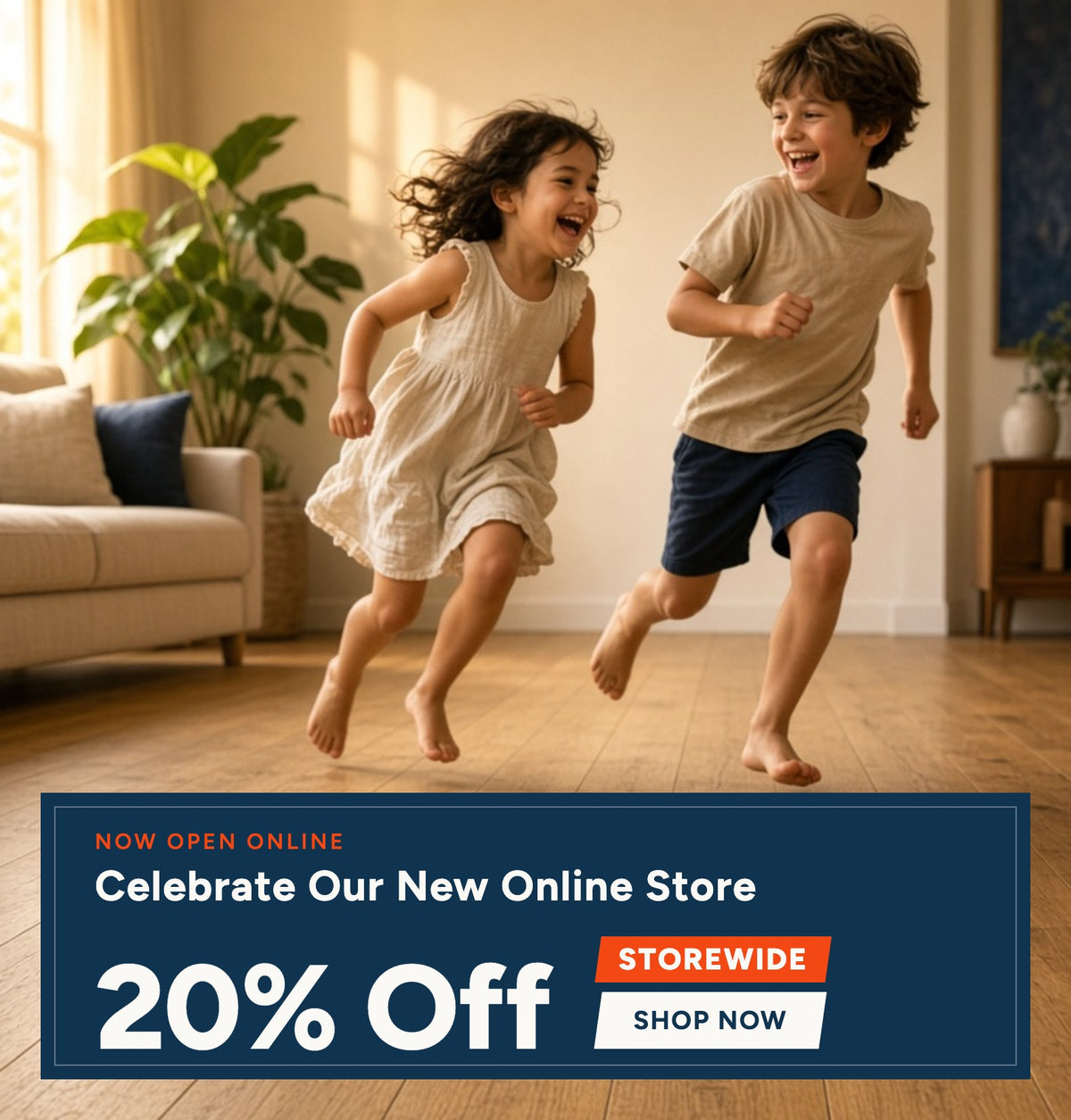 A boy and a girl run happily across a wooden floor in a bright living room. A large promotional banner at the bottom reads 'Now Open Online Celebrate Our New Online Store 20% Off Storewide Shop Now.